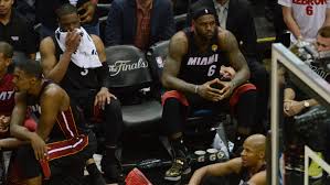 LeBron sitting on the bench looking disappointed after the 2011 Finals loss