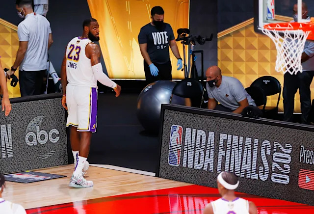 LeBron walking off the court after the 2014 Finals loss, looking reflective